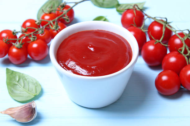 Ketchup on the table. Tomato sauce, fresh tomatoes. High quality photo