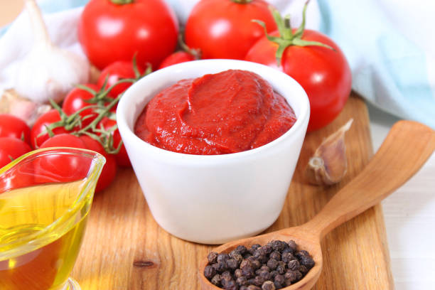 Tomato paste on the table top view. Tomato sauce. High quality photo